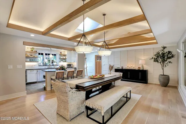 a kitchen with stainless steel appliances kitchen island granite countertop a sink and cabinets
