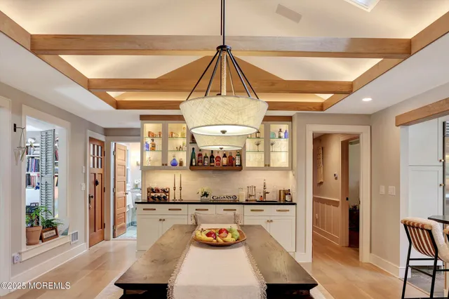 a living room with furniture a rug and a window
