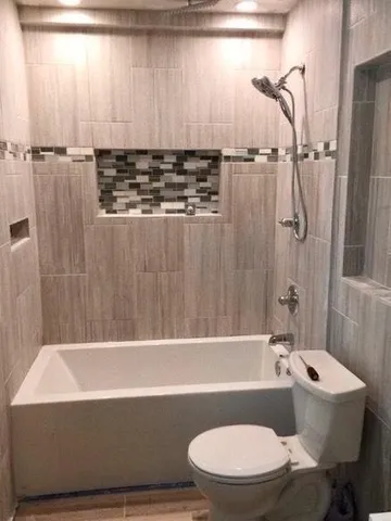 a bathroom with a sink a toilet and bathtub