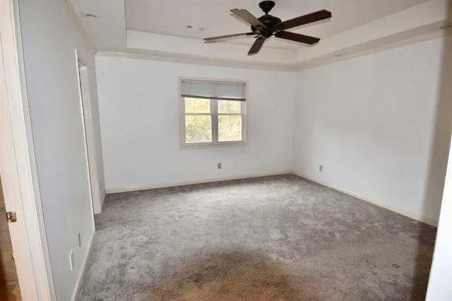 a view of an empty room and a window