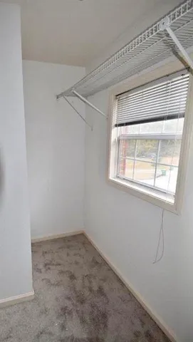 a view of a room that has a window in it