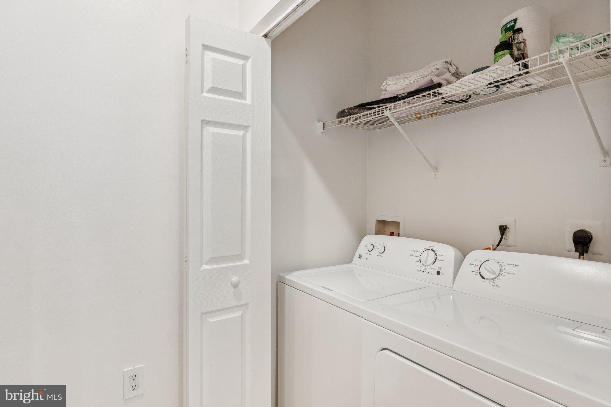 11800 Old Georgetown Road, Unit 1120 North Bethesda, MD 20852 - Photo 18 of 36 a utility room with dryer and washer