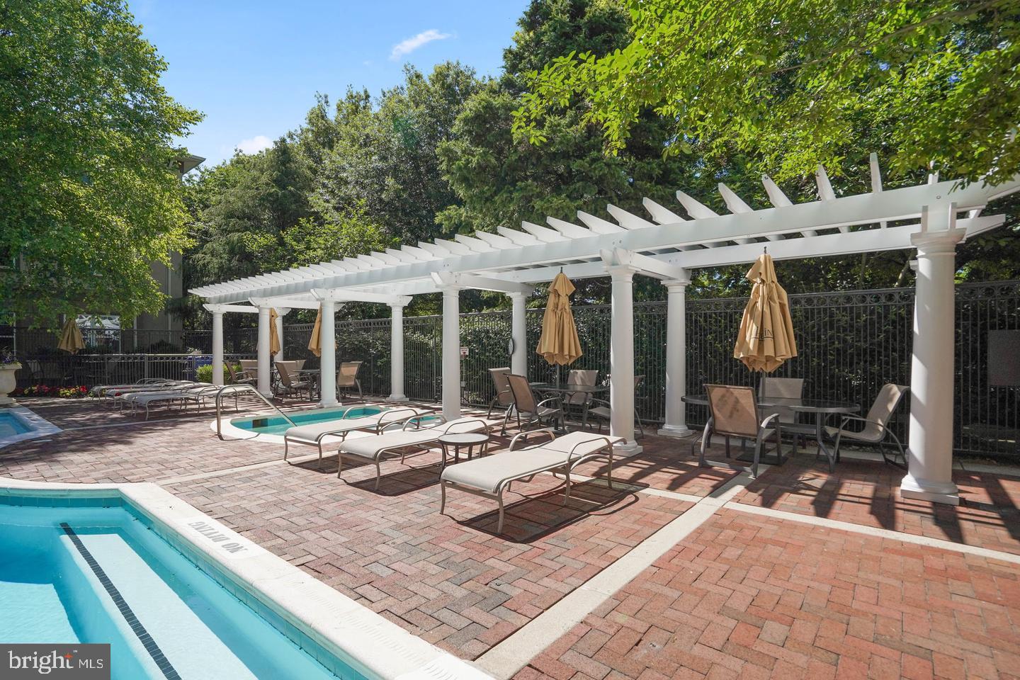 11800 Old Georgetown Road, Unit 1120 North Bethesda, MD 20852 - Photo 29 of 36 a view of house with backyard outdoor seating and covered with tall trees