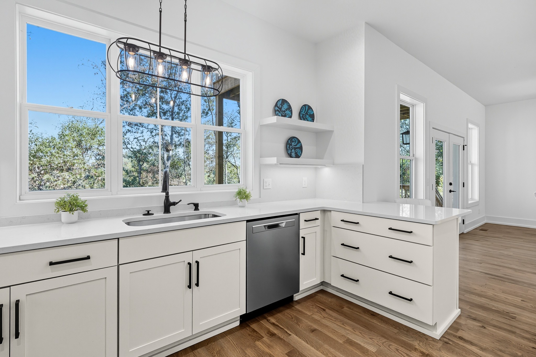 294 Rio Vista Drive Madison, TN 37115 - Photo 19 of 69 a view of cabinets a sink and dishwasher with wooden floor