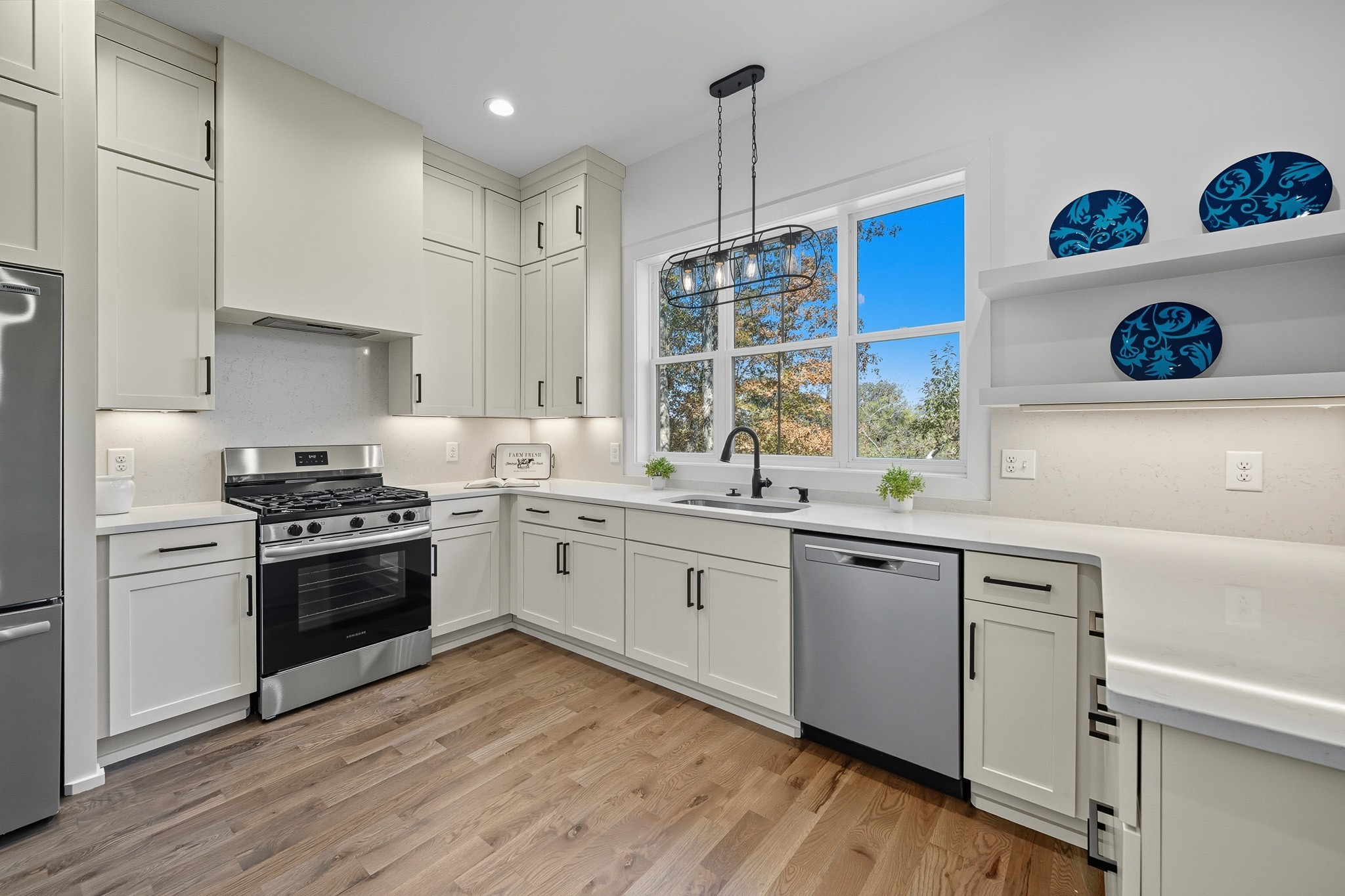 294 Rio Vista Drive Madison, TN 37115 - Photo 21 of 69 a kitchen with a sink cabinets and wooden floor
