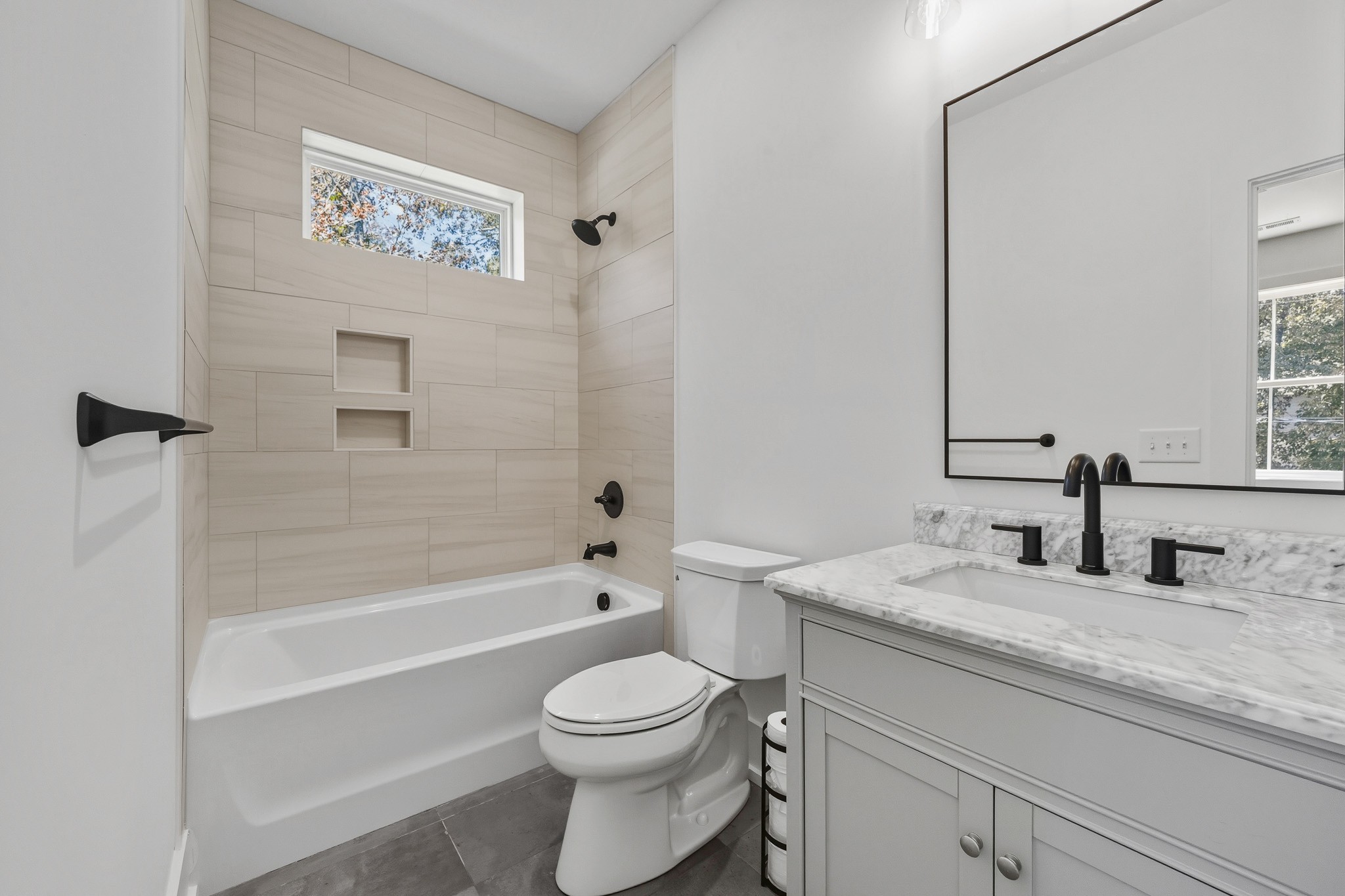 294 Rio Vista Drive Madison, TN 37115 - Photo 37 of 69 a bathroom with a granite countertop toilet a sink and a bathtub