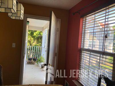 31 Edinburgh Court Edison, NJ 08820 - Photo 14 of 25 a view of a balcony with wooden floor
