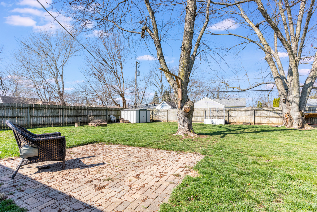 78 Springdale Road Montgomery, IL 60538 - Photo 17 of 21 a bench is sitting in the middle of a yard