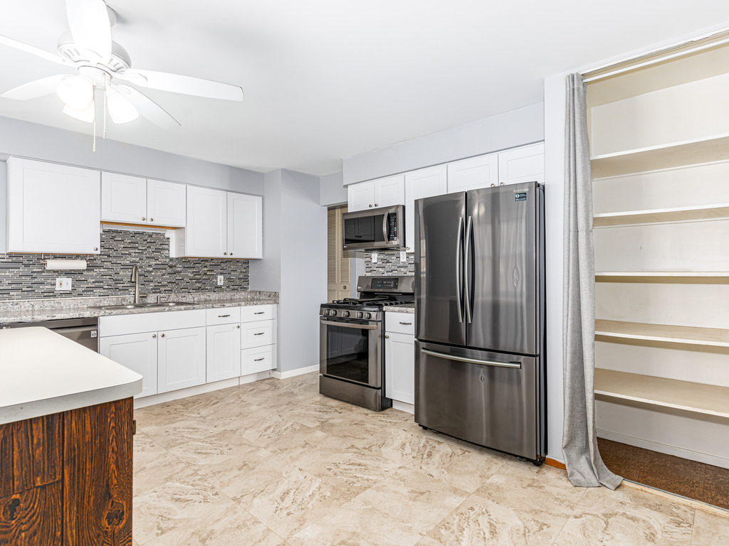 78 Springdale Road Montgomery, IL 60538 - Photo 5 of 21 a kitchen with stainless steel appliances granite countertop a refrigerator stove and sink