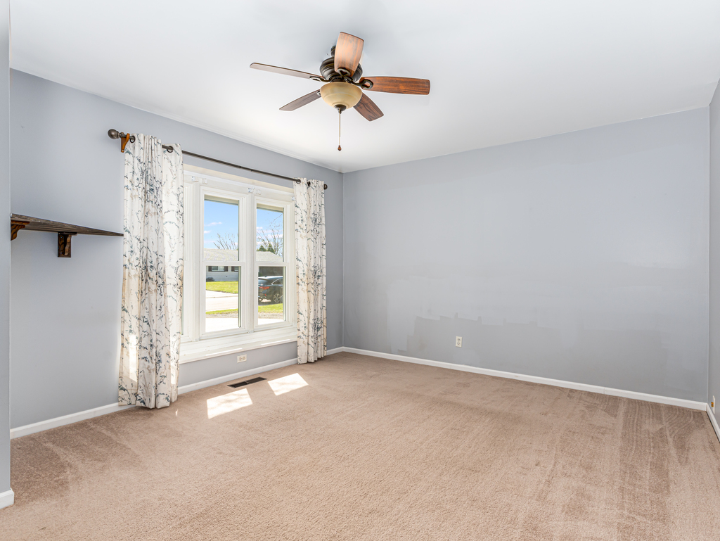 78 Springdale Road Montgomery, IL 60538 - Photo 10 of 21 a view of an empty room with a window