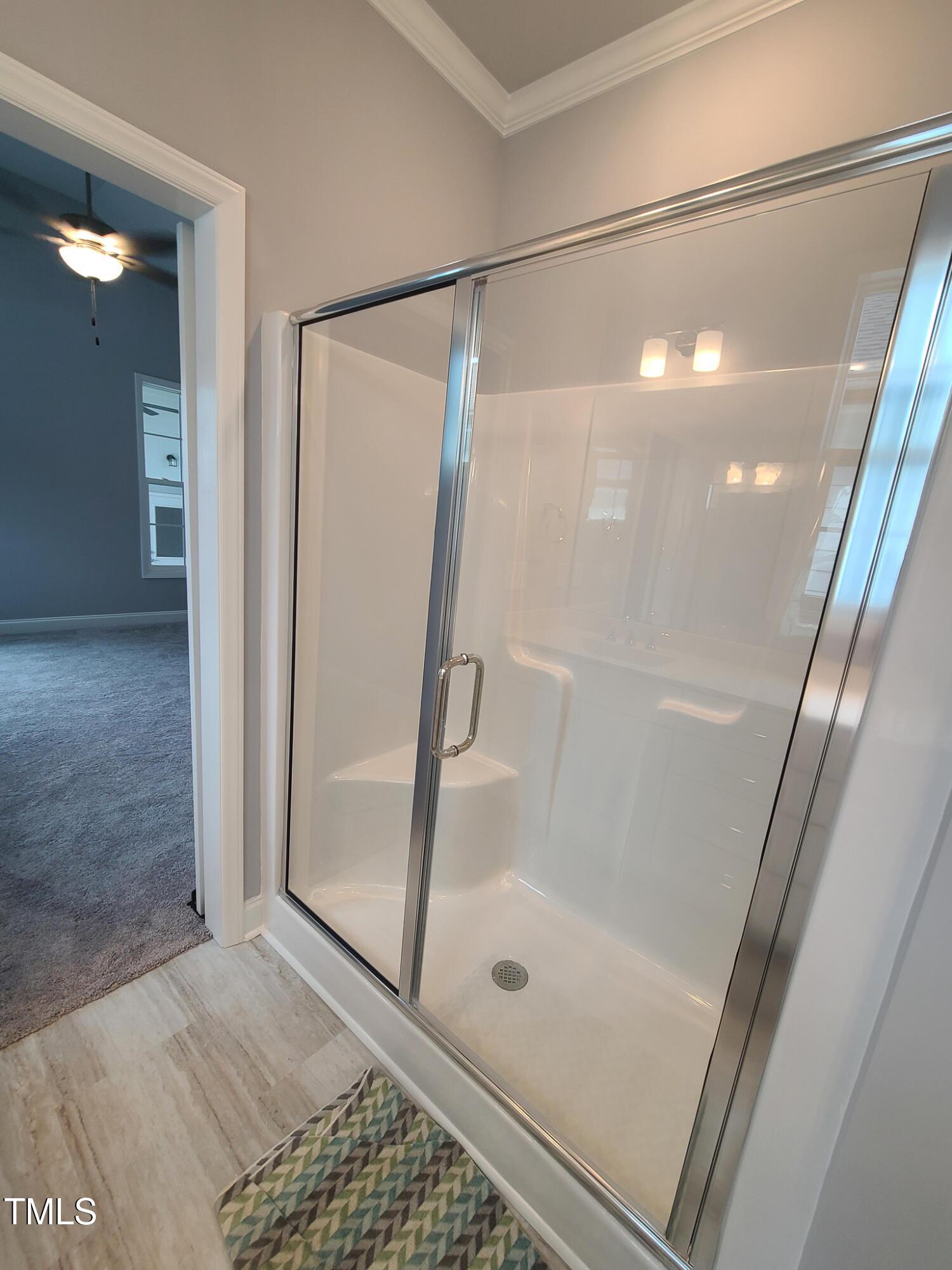 1629 Glazebrook Drive Wake Forest, NC 27587 - Photo 16 of 35 a bathroom with a glass shower door and a sink