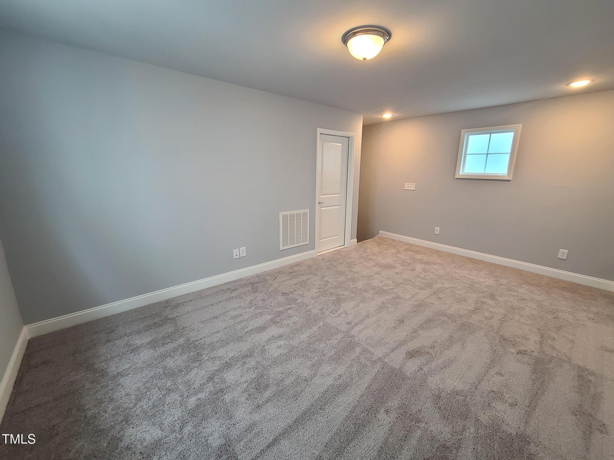 1629 Glazebrook Drive Wake Forest, NC 27587 - Photo 21 of 35 a view of an empty room with a window