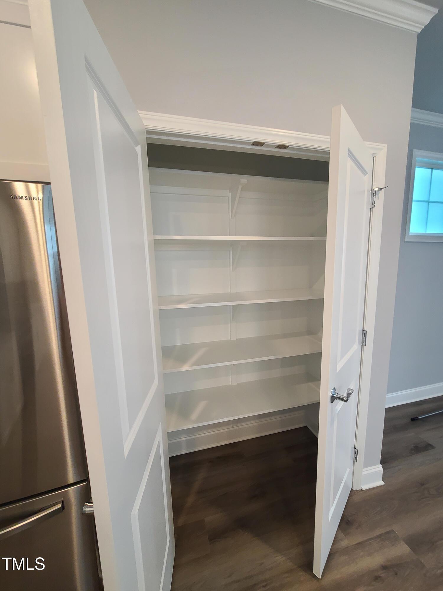 1629 Glazebrook Drive Wake Forest, NC 27587 - Photo 9 of 35 a view of walk in closet with empty racks