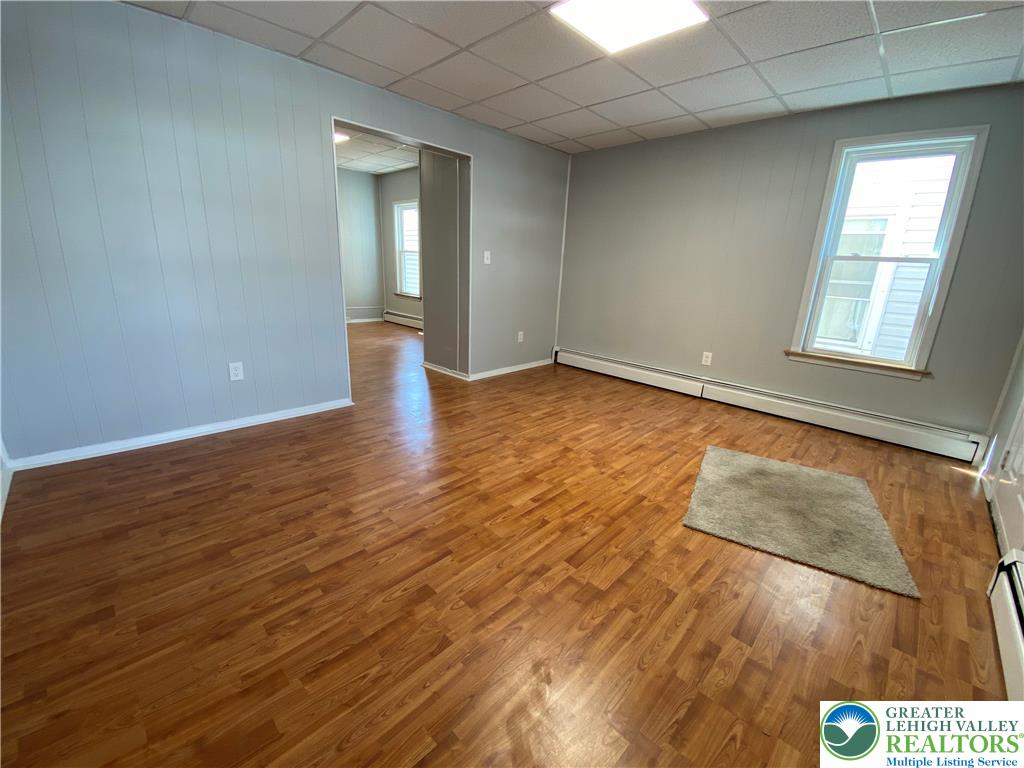 350 Lehigh Avenue Palmerton, PA 18071 - Photo 2 of 18 an empty room with wooden floor and windows