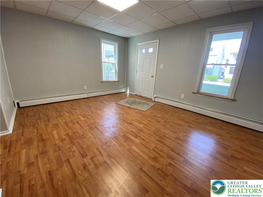 350 Lehigh Avenue Palmerton, PA 18071 - Photo 3 of 18 an empty room with wooden floor and windows