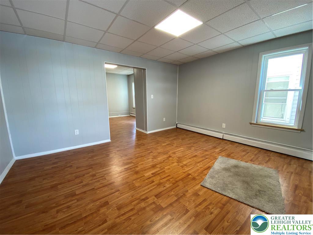 350 Lehigh Avenue Palmerton, PA 18071 - Photo 6 of 18 a view of an empty room with wooden floor and a window