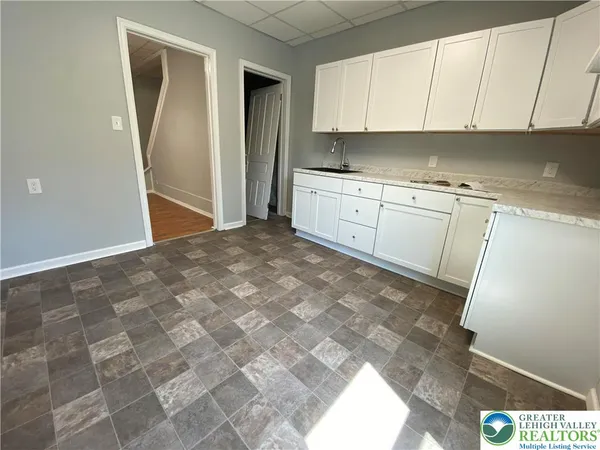 a view of a kitchen with a sink