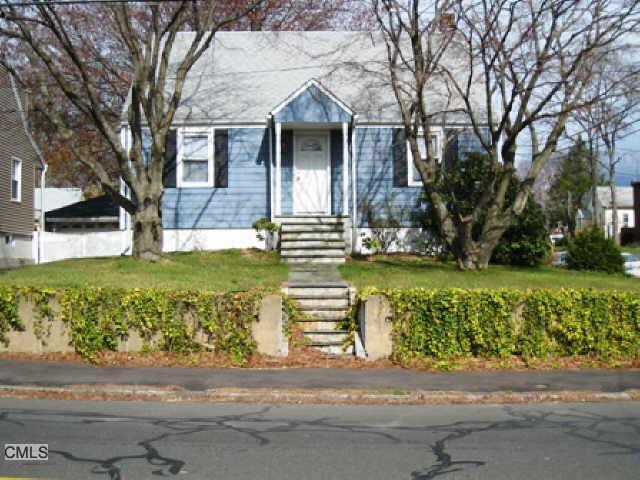 450 Jennings Road Fairfield, CT 06824 - Photo 1 of 1 a front view of a house with garden