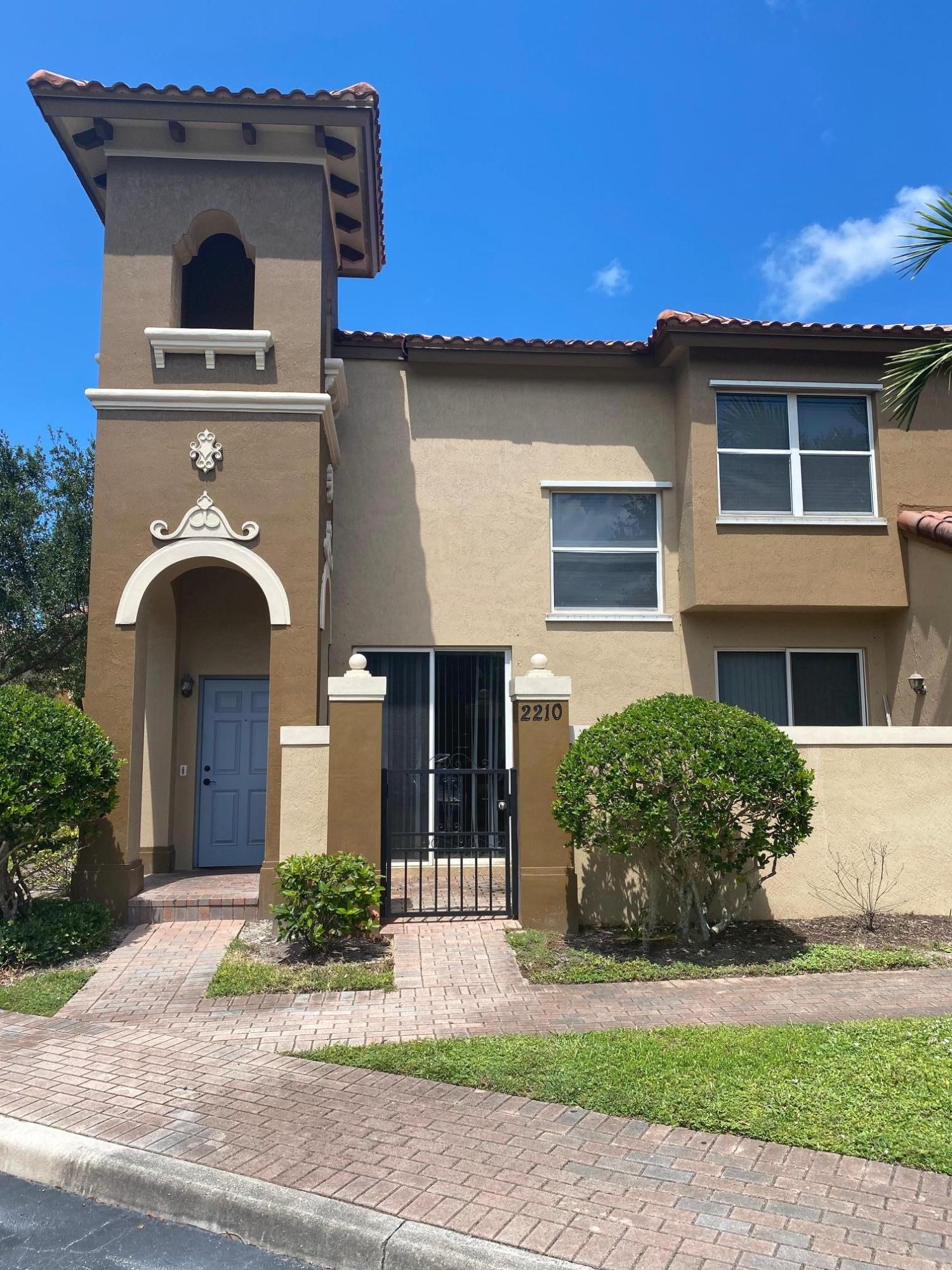 2905 Hidden Hills Road, Unit 2210 West Palm Beach, FL 33411 - Photo 2 of 27 Front