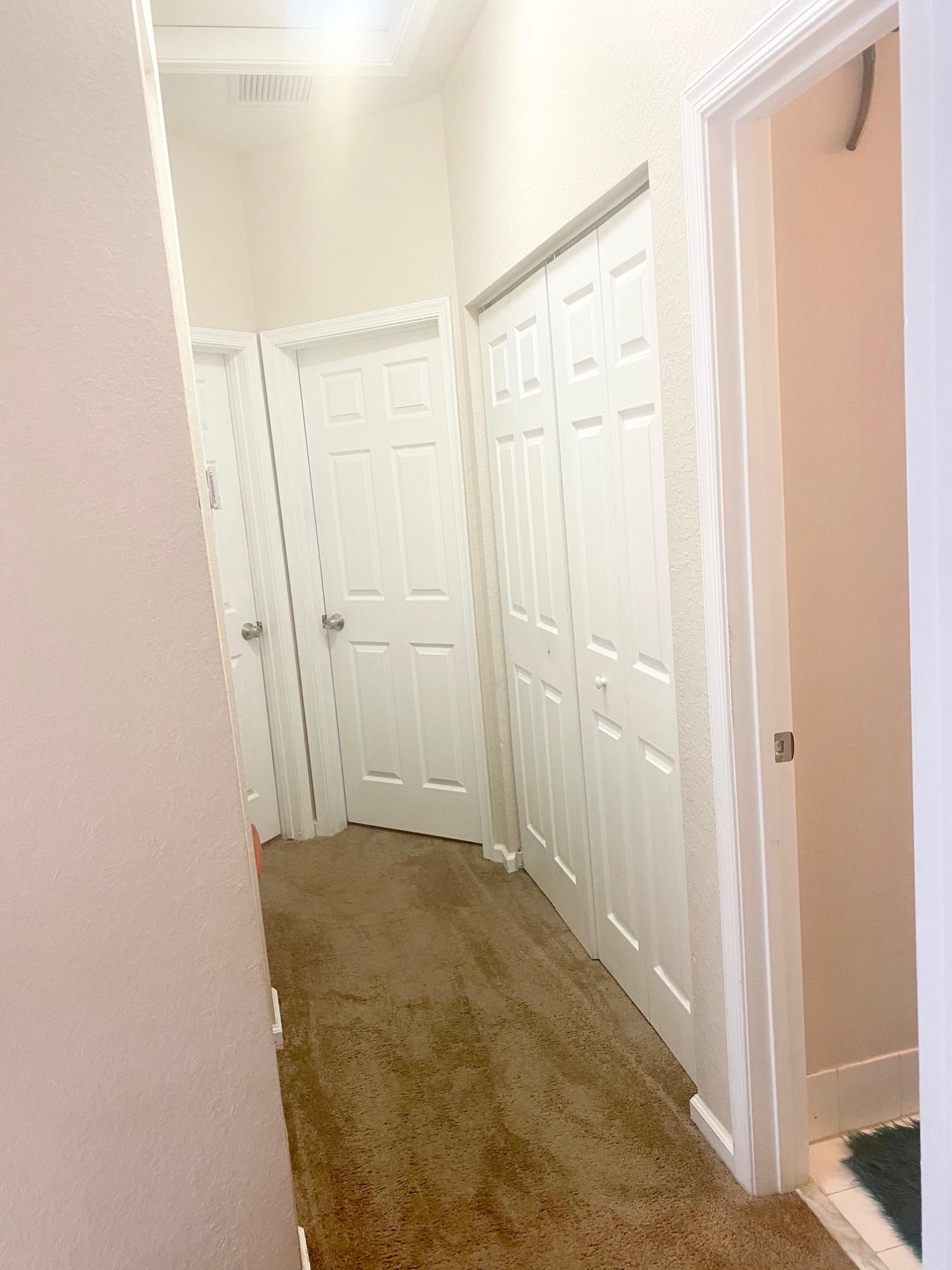 2905 Hidden Hills Road, Unit 2210 West Palm Beach, FL 33411 - Photo 23 of 27 upstairs hallway