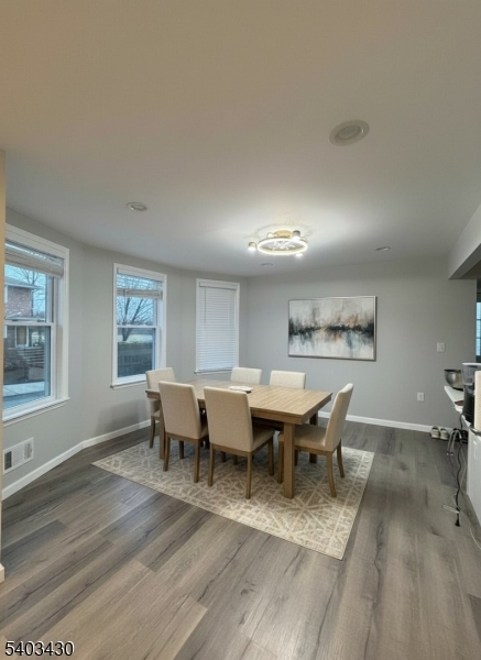 49 Blaine Street Millburn, NJ 07041 - Photo 3 of 10 a view of a dining room with furniture window and wooden floor