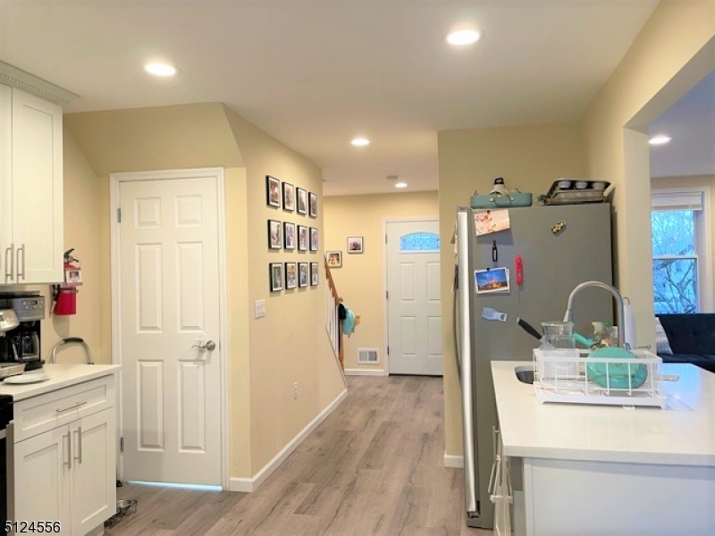 49 Blaine Street Millburn, NJ 07041 - Photo 5 of 10 a view of kitchen dining space with furniture and wooden floor