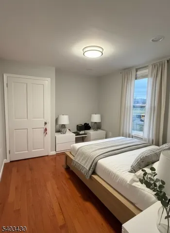 a bedroom with bed and window