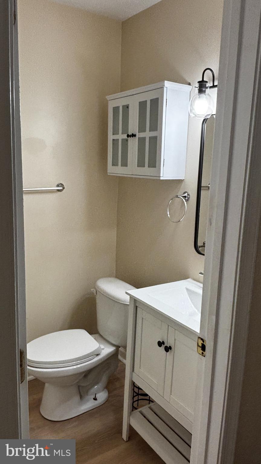 1240 18th Street Northeast, Unit 2 Washington, DC 20002 - Photo 11 of 11 a white toilet sitting next to a bathroom sink