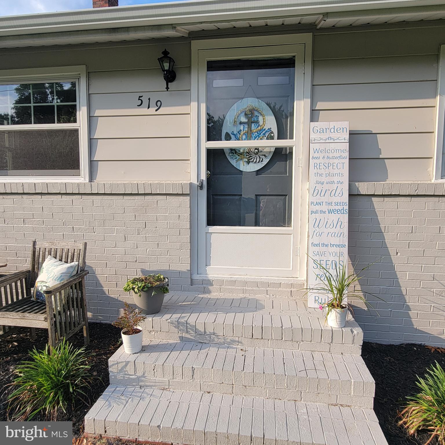 519 Whitehall Road Lancaster, VA 22503 - Photo 11 of 46 a front view of a house with outdoor seating