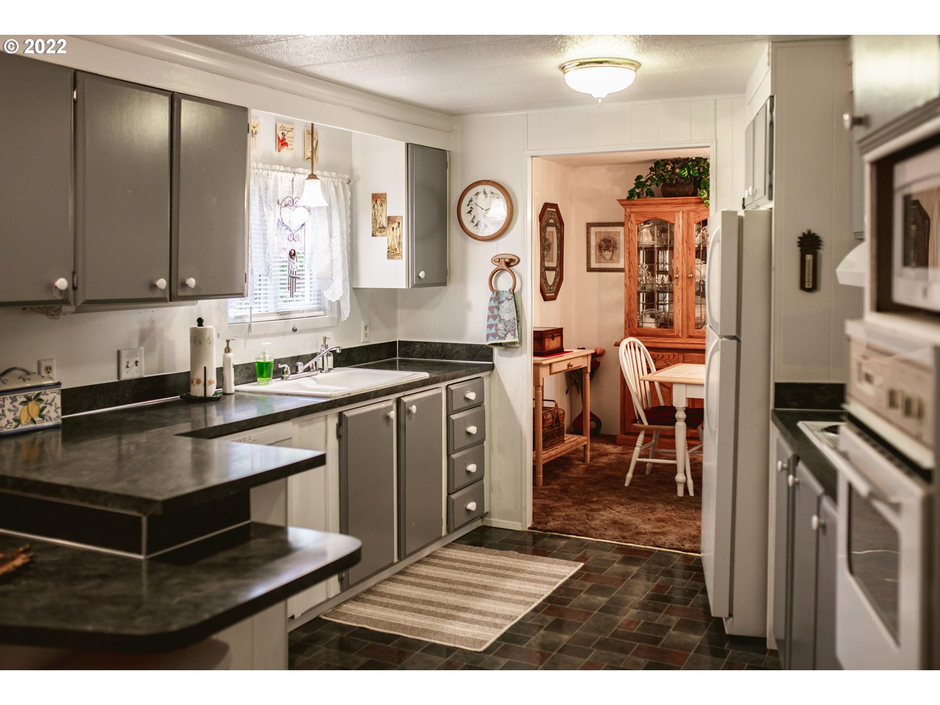1625 Henderson Avenue, Unit E2 Eugene, OR 97403 - Photo 12 of 26 a kitchen with stainless steel appliances granite countertop a stove and a sink
