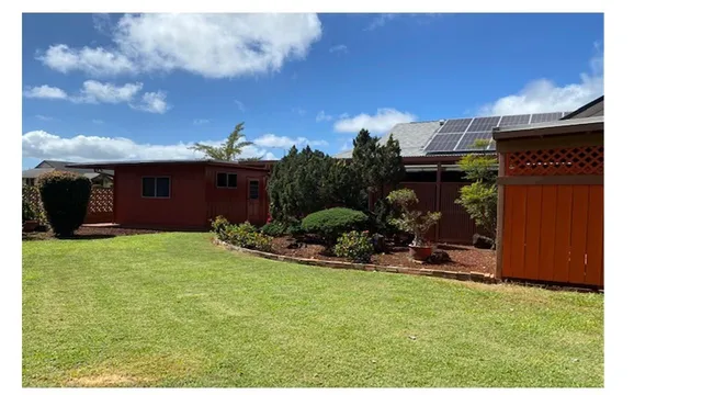 a view of a house with backyard porch and sitting area