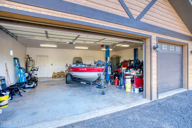 a view of a room with lots of furniture and clutter