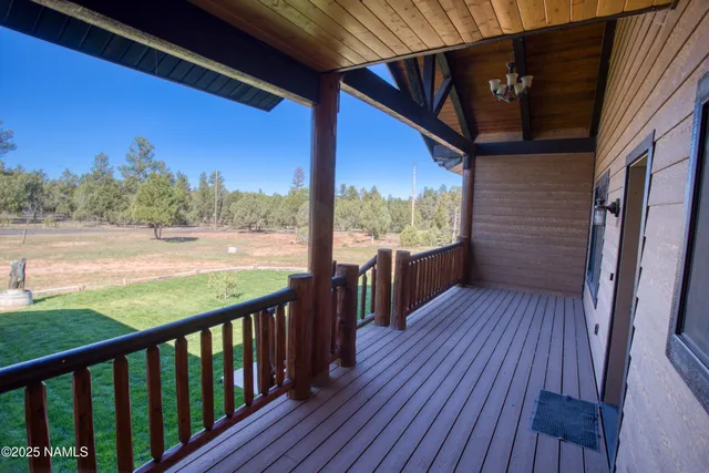a view of balcony with wooden floor