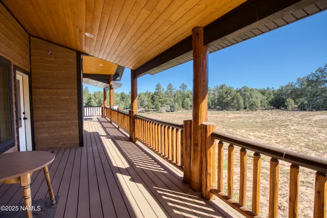 a view of a balcony with wooden floor