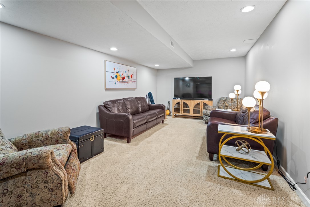 55 Janney Lane Springboro, OH 45066 - Photo 34 of 38 This versatile recreation room features soft carpeting and ample lighting for comfortable gatherings.