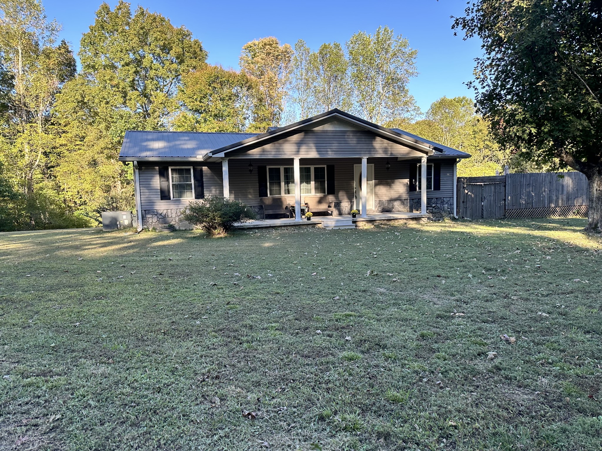 8376 Chestnut Ridge Road Lynchburg, TN 37352 - Photo 1 of 37 a front view of a house with garden