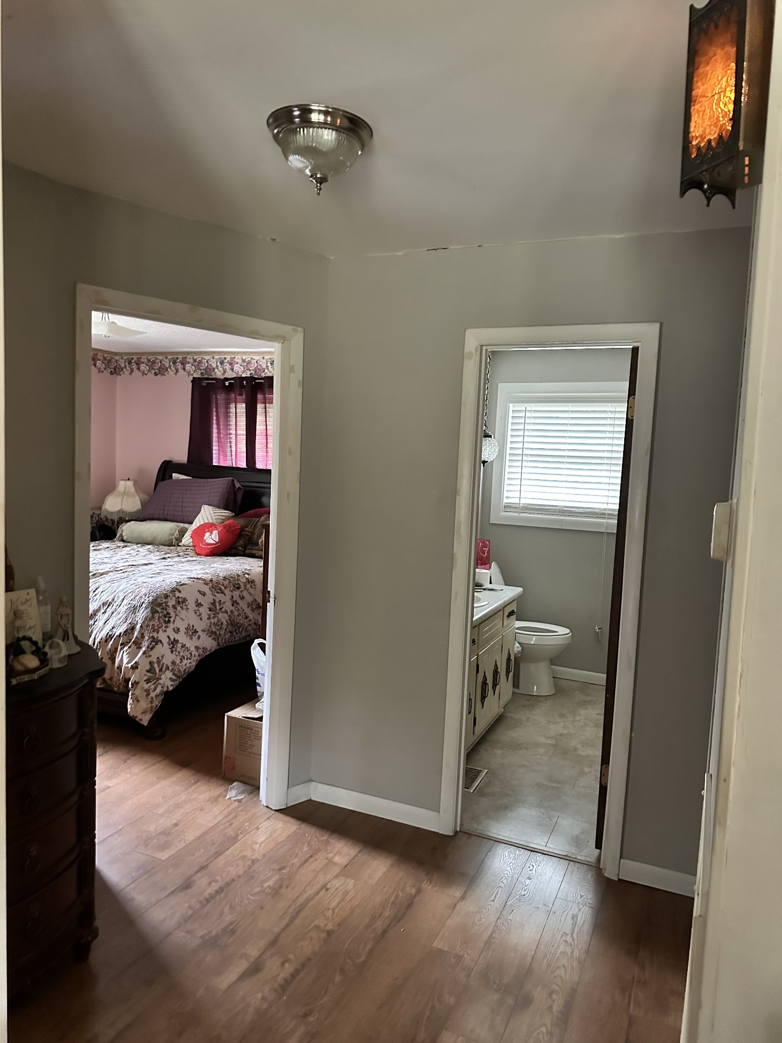 8376 Chestnut Ridge Road Lynchburg, TN 37352 - Photo 31 of 37 a bedroom with a bed and wooden floor