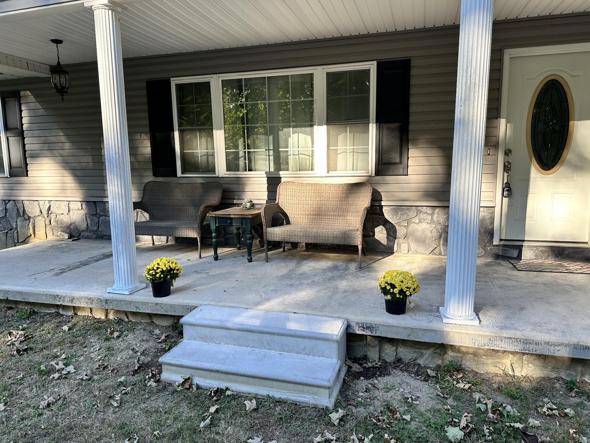 8376 Chestnut Ridge Road Lynchburg, TN 37352 - Photo 4 of 37 a front view of a house with outdoor seating