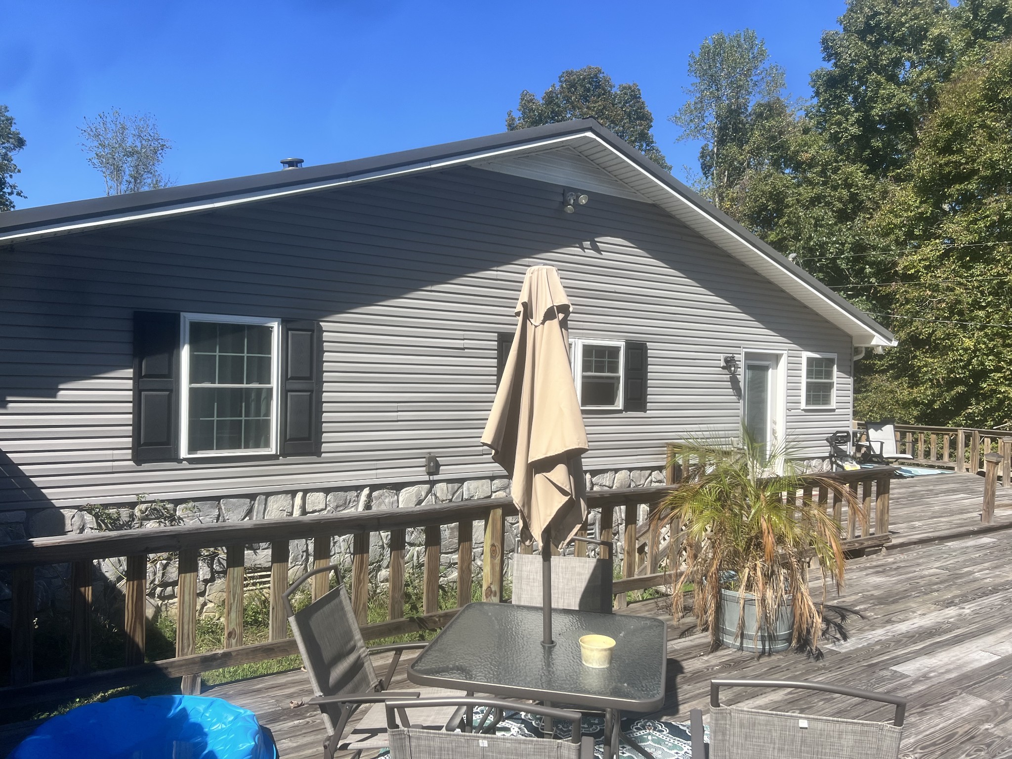 8376 Chestnut Ridge Road Lynchburg, TN 37352 - Photo 5 of 37 a backyard of a house with table and chairs