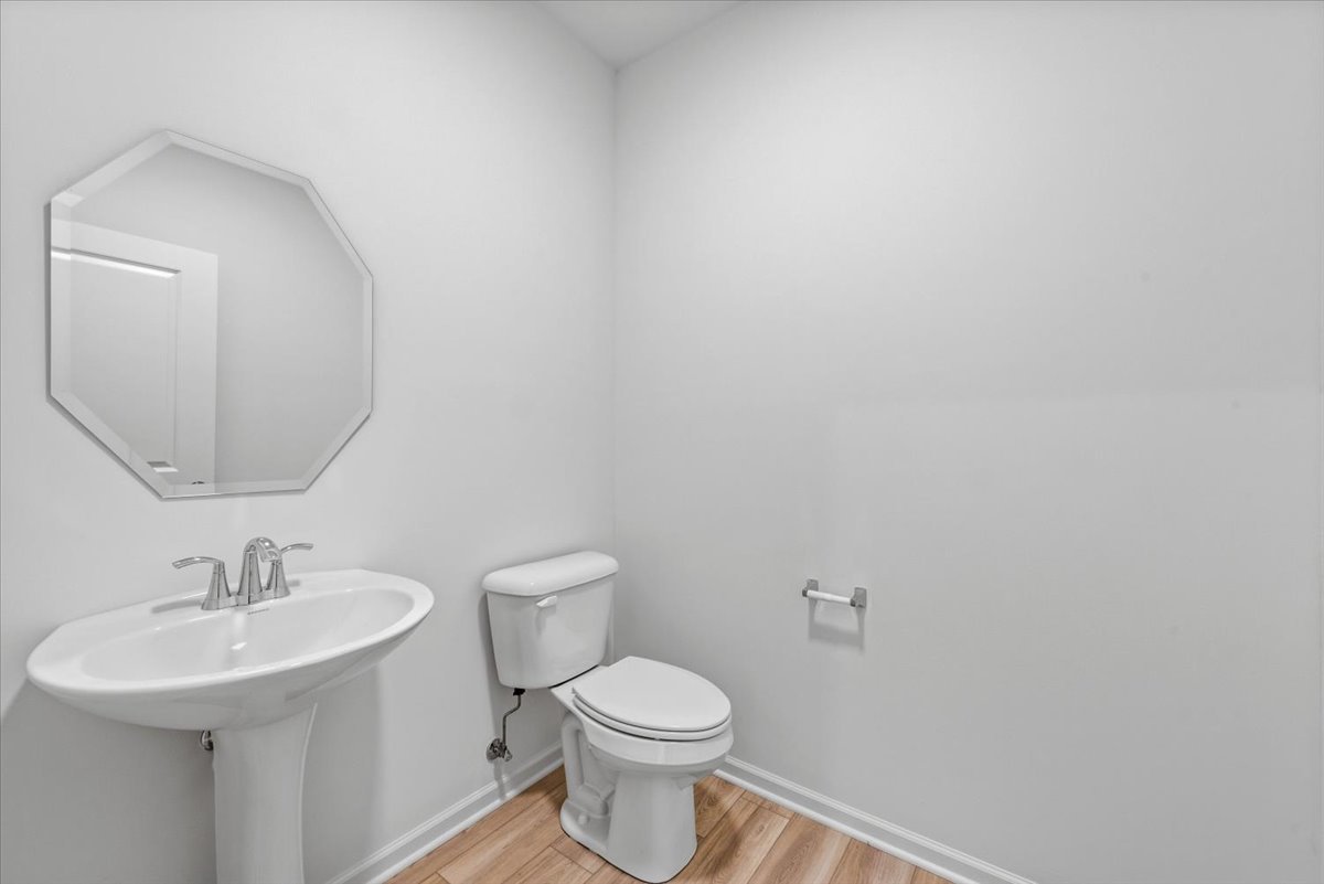 89 Hedgerow Drive Elgin, IL 60124 - Photo 12 of 51 a bathroom with a toilet sink and mirror