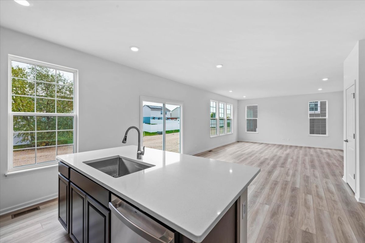 89 Hedgerow Drive Elgin, IL 60124 - Photo 19 of 51 a kitchen with a sink and large window