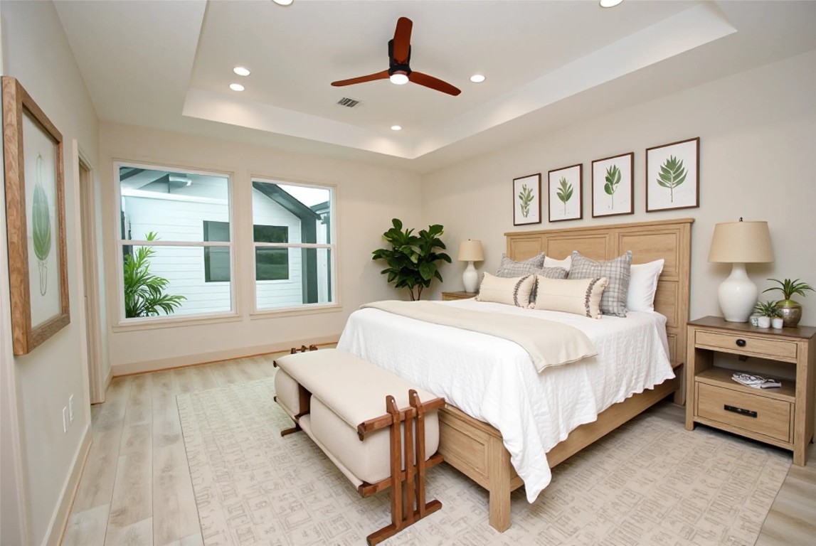 6310 Illinois Street, Unit A Houston, TX 77021 - Photo 13 of 22 a bed room with a bed and a painting on the wall