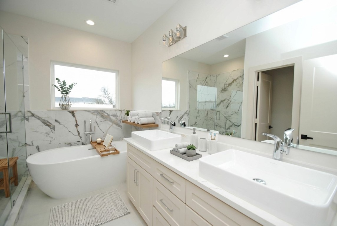 6310 Illinois Street, Unit A Houston, TX 77021 - Photo 14 of 22 a bathroom with a double vanity sink mirror and bathtub