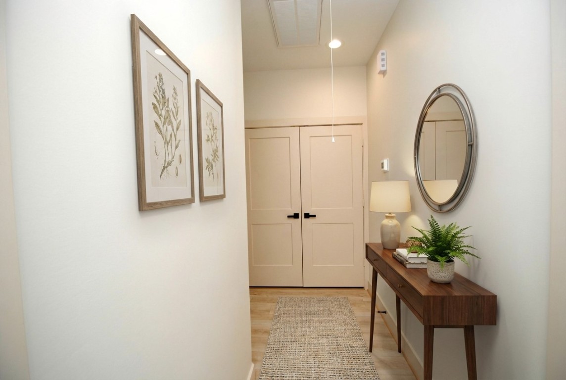 6310 Illinois Street, Unit A Houston, TX 77021 - Photo 21 of 22 a view of a hallway with paintings on the wall