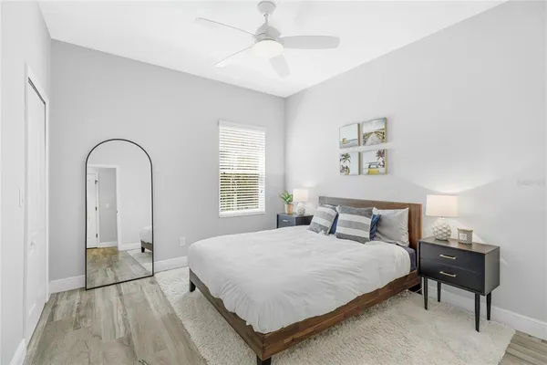 a bedroom with a bed and a window