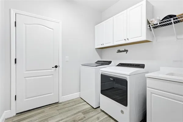 a utility room with dryer and washer