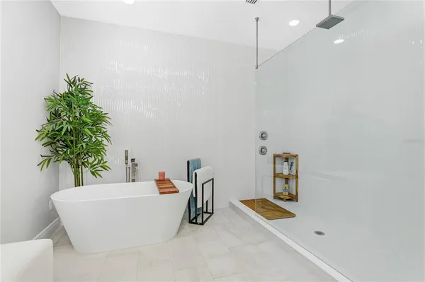a white tub sitting in a bathroom