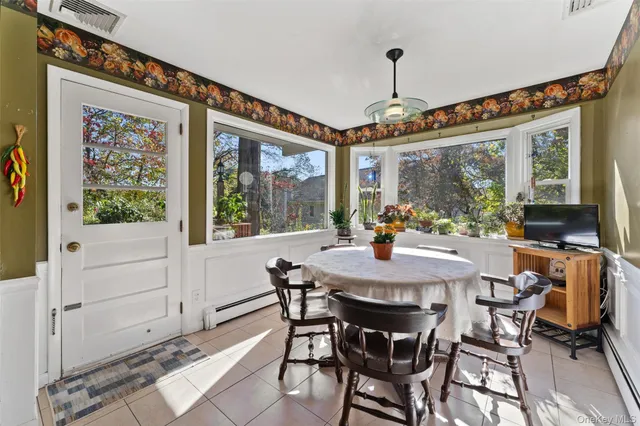 a view of a dining room with furniture window and outside view