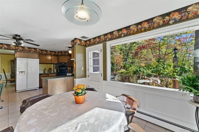 a view of a living room and kitchen