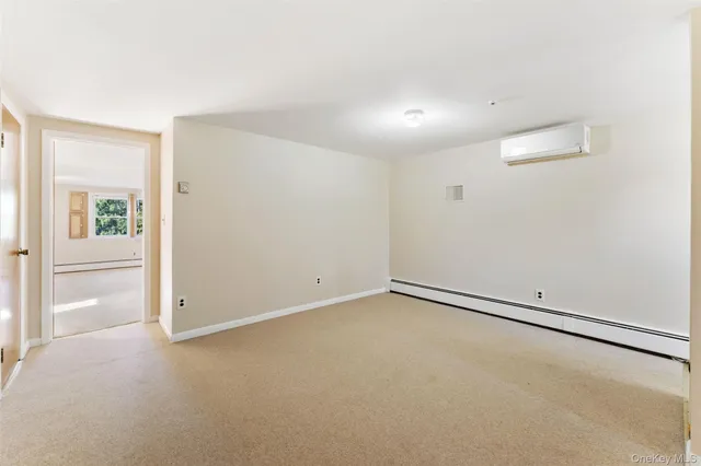 an empty room with a empty space and windows